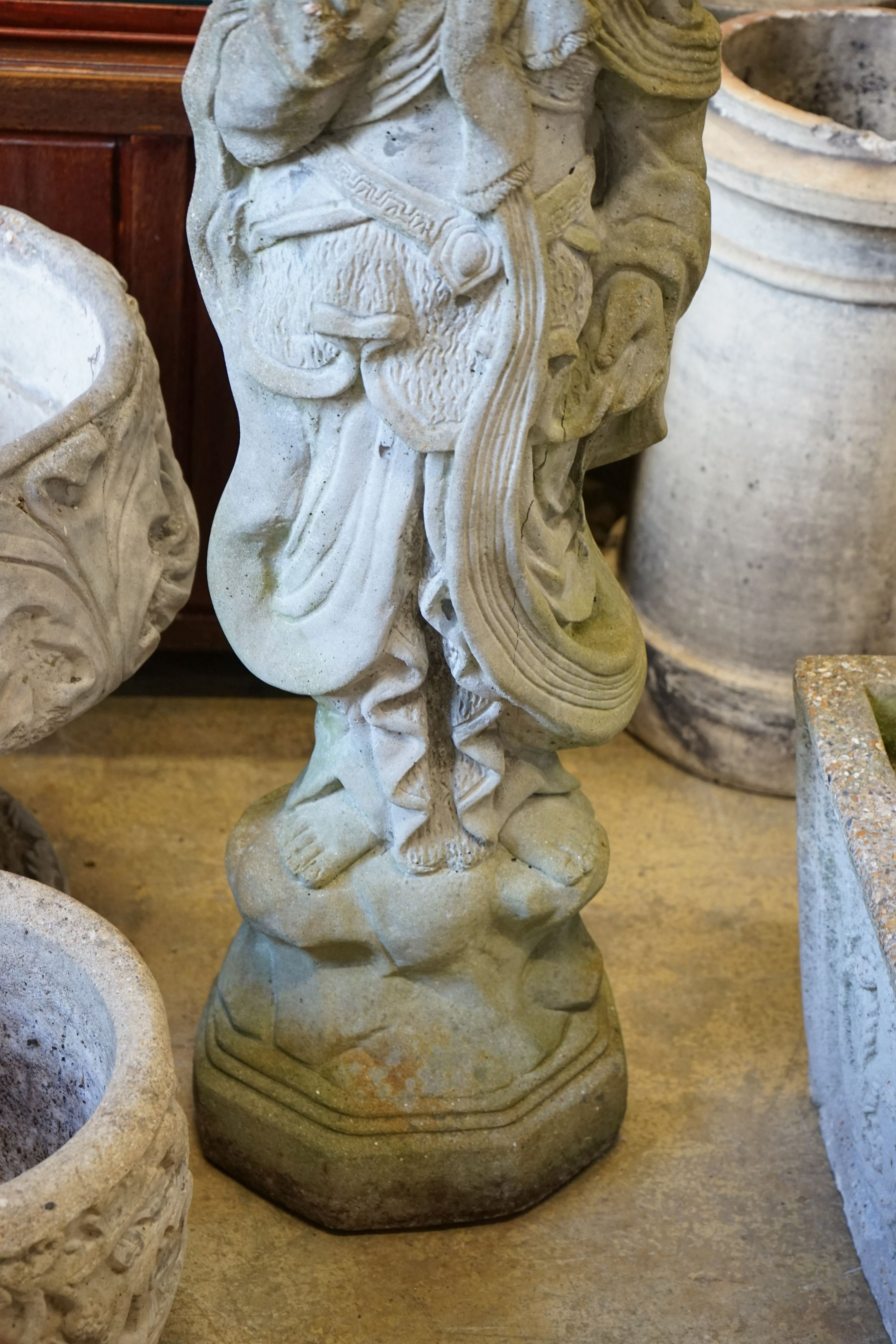 A Chinese style reconstituted stone figural garden ornament, diameter 50cm, height 104cm